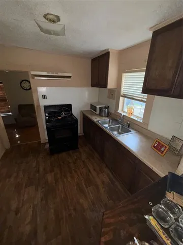 a kitchen with a stove and a refrigerator