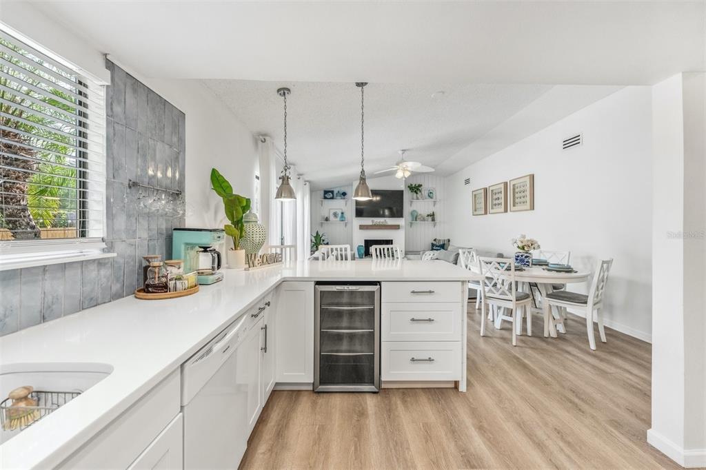 2911 Woodpine Court Sarasota, FL 34231 - Photo 14 of 88 a kitchen with a sink stove and cabinets