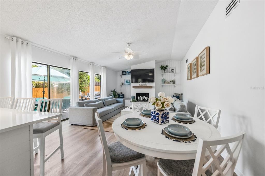 2911 Woodpine Court Sarasota, FL 34231 - Photo 17 of 88 a view of a dining room with furniture large window and outside view