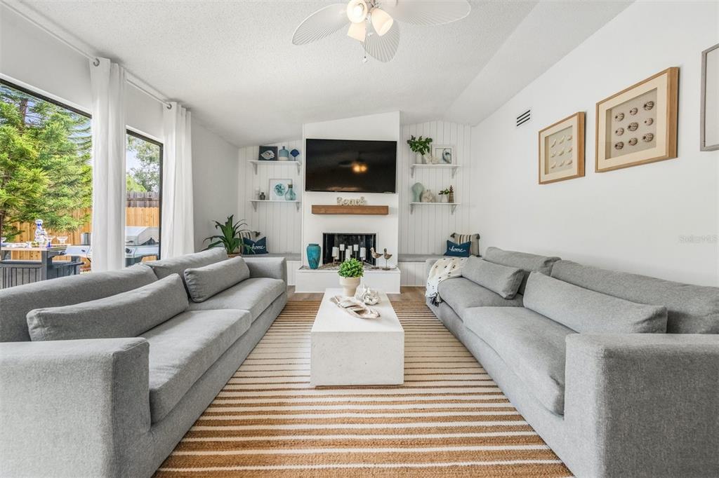 2911 Woodpine Court Sarasota, FL 34231 - Photo 20 of 88 a living room with furniture and a flat screen tv