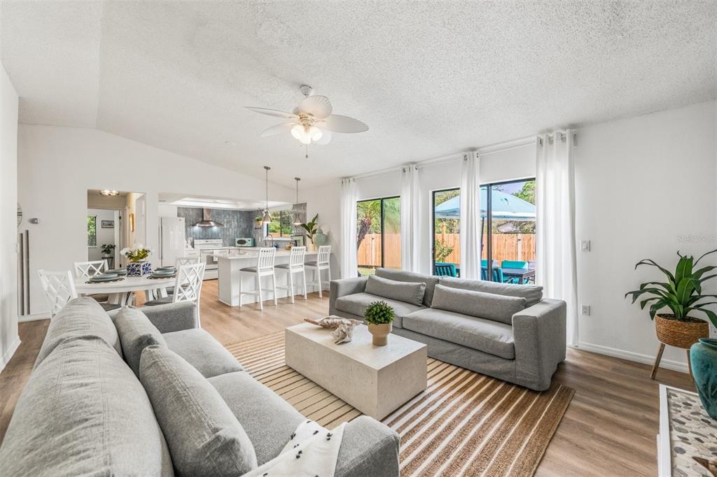 2911 Woodpine Court Sarasota, FL 34231 - Photo 21 of 88 a living room with furniture and a large window