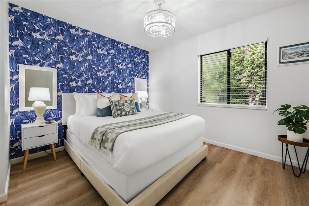 2911 Woodpine Court Sarasota, FL 34231 - Photo 37 of 88 a bedroom with bed and a window