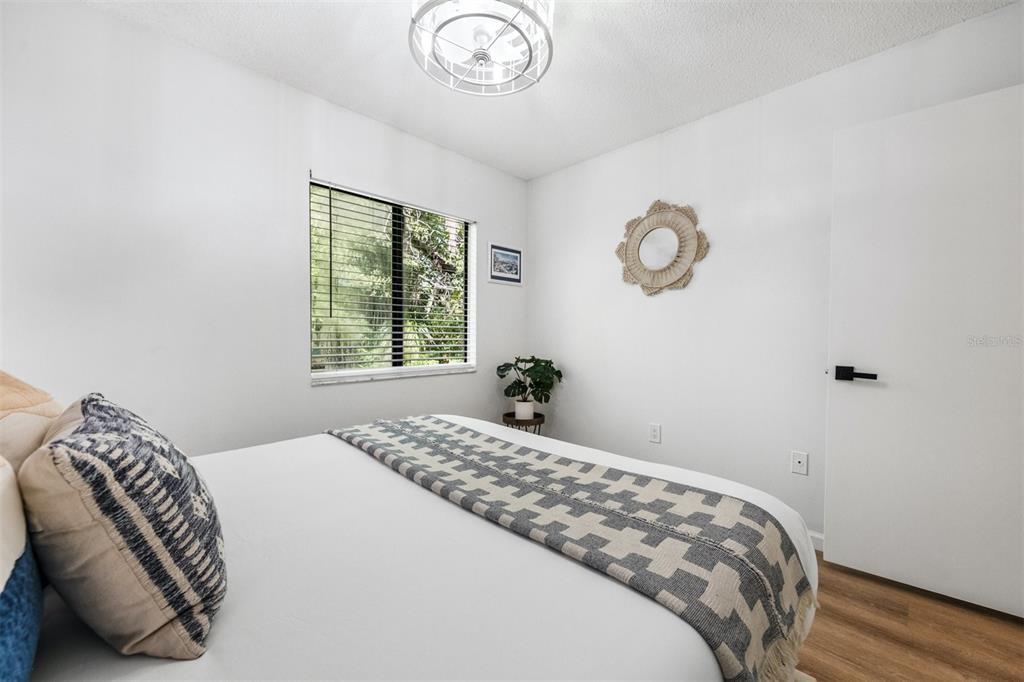 2911 Woodpine Court Sarasota, FL 34231 - Photo 40 of 88 a bedroom with a bed and a window