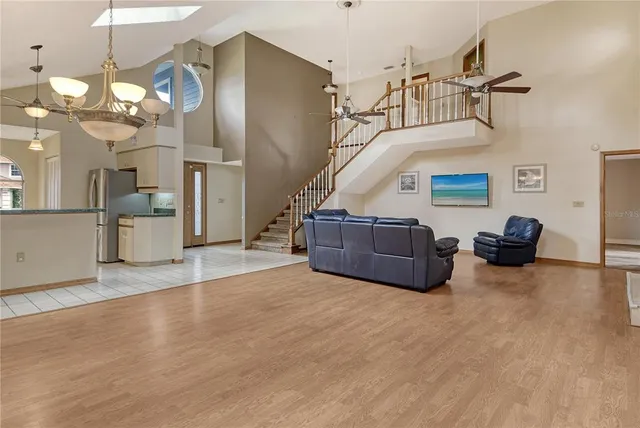 a view of a kitchen with a stove cabinets and a kitchen counter space