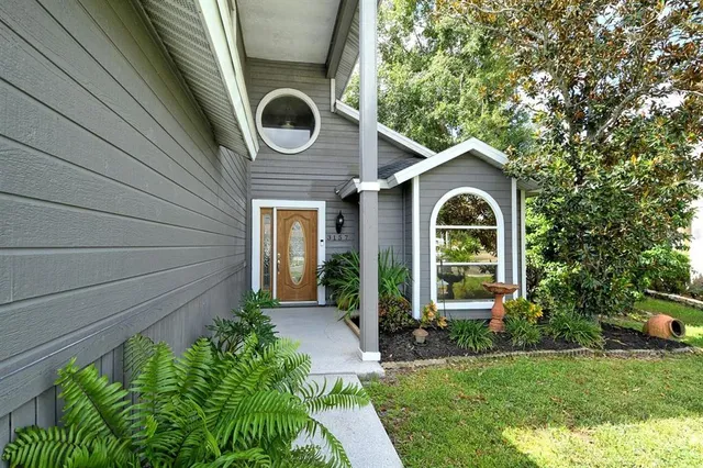 a front view of a house with garden