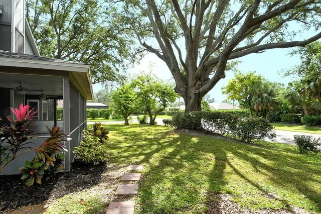 a view of backyard with swimming pool