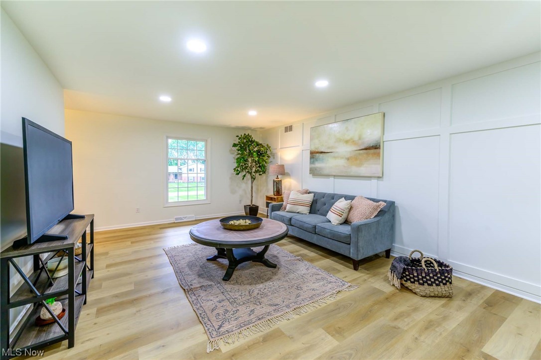 1820 Spring Valley Avenue Northwest Canton, OH 44708 - Photo 13 of 32 Living room featuring light hardwood floors