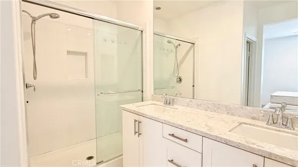 a bathroom with a granite countertop sink mirror and a
