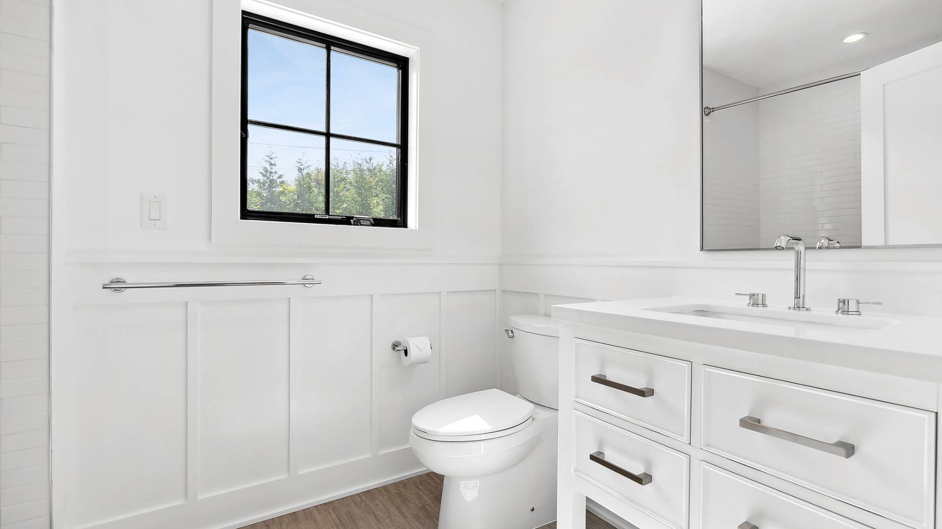 6 Inkberry Street East Hampton, NY 11937 - Photo 11 of 18 a bathroom with a toilet a sink a vanity and mirror