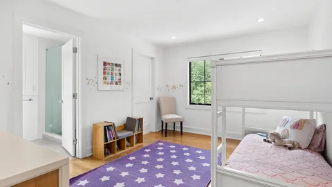 a living room with furniture rug and a window