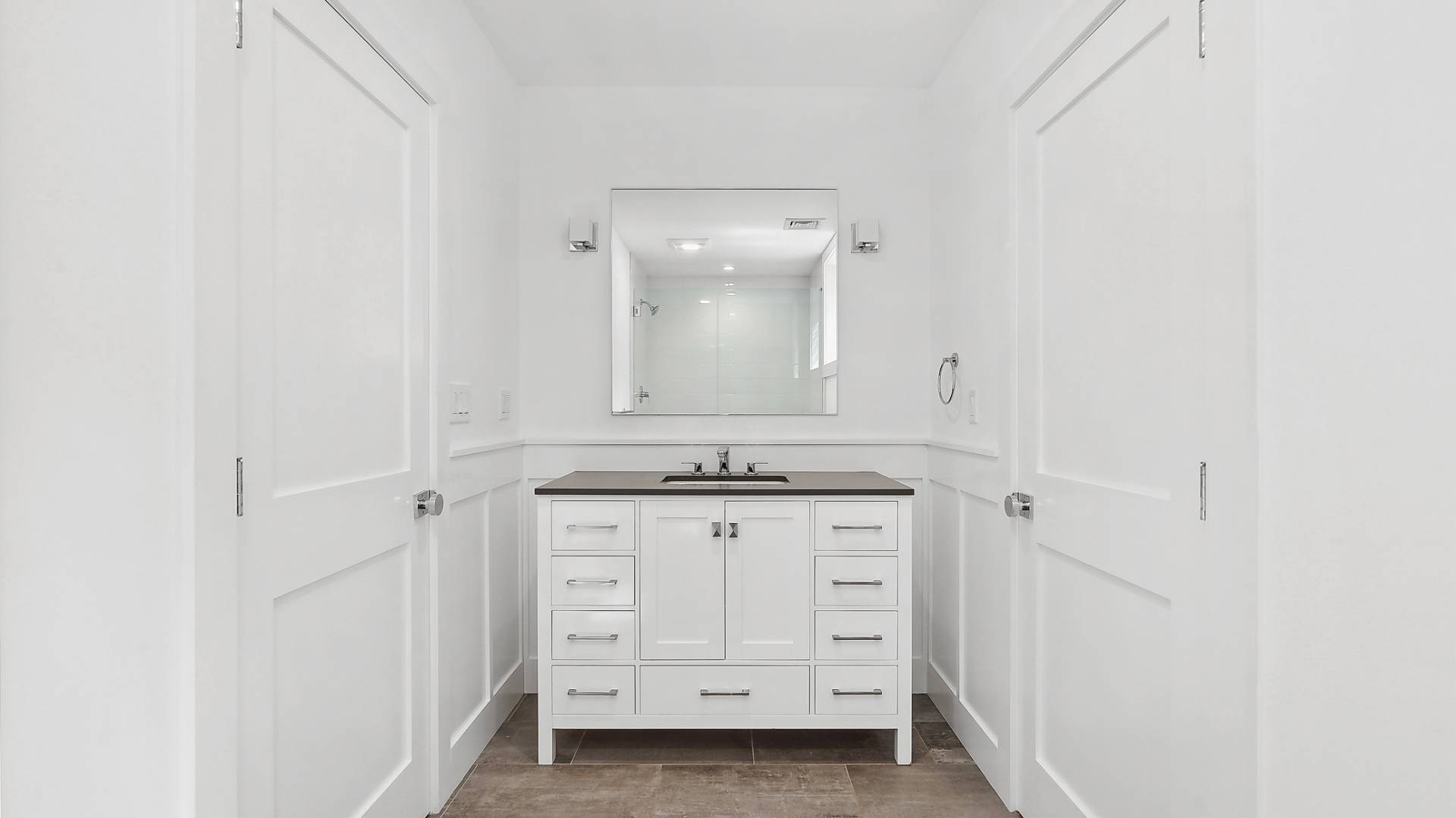 6 Inkberry Street East Hampton, NY 11937 - Photo 15 of 18 a bathroom with a granite countertop sink and a mirror