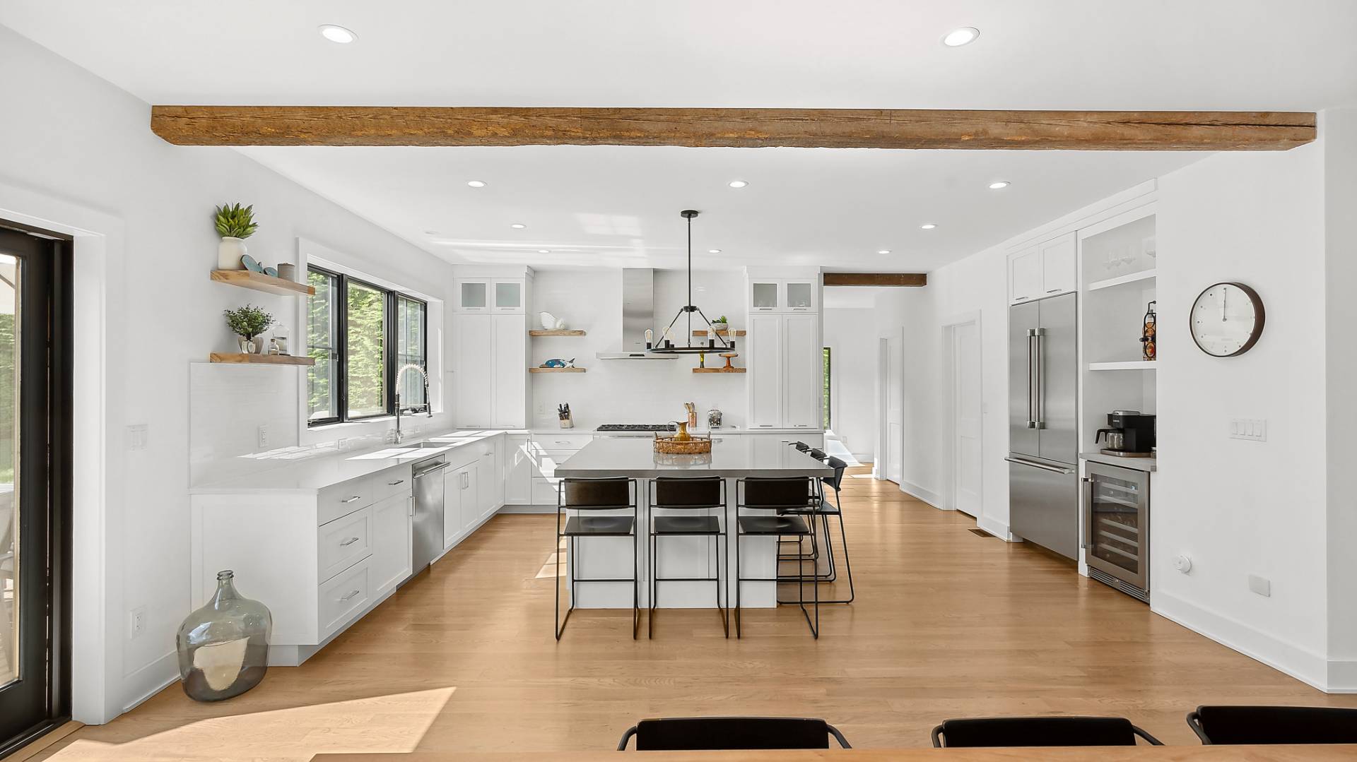 6 Inkberry Street East Hampton, NY 11937 - Photo 3 of 18 a large white kitchen with a large window
