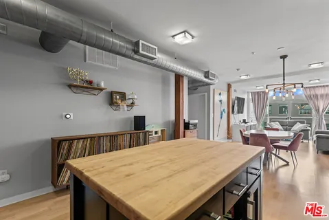 a dining table with chairs and wooden floor
