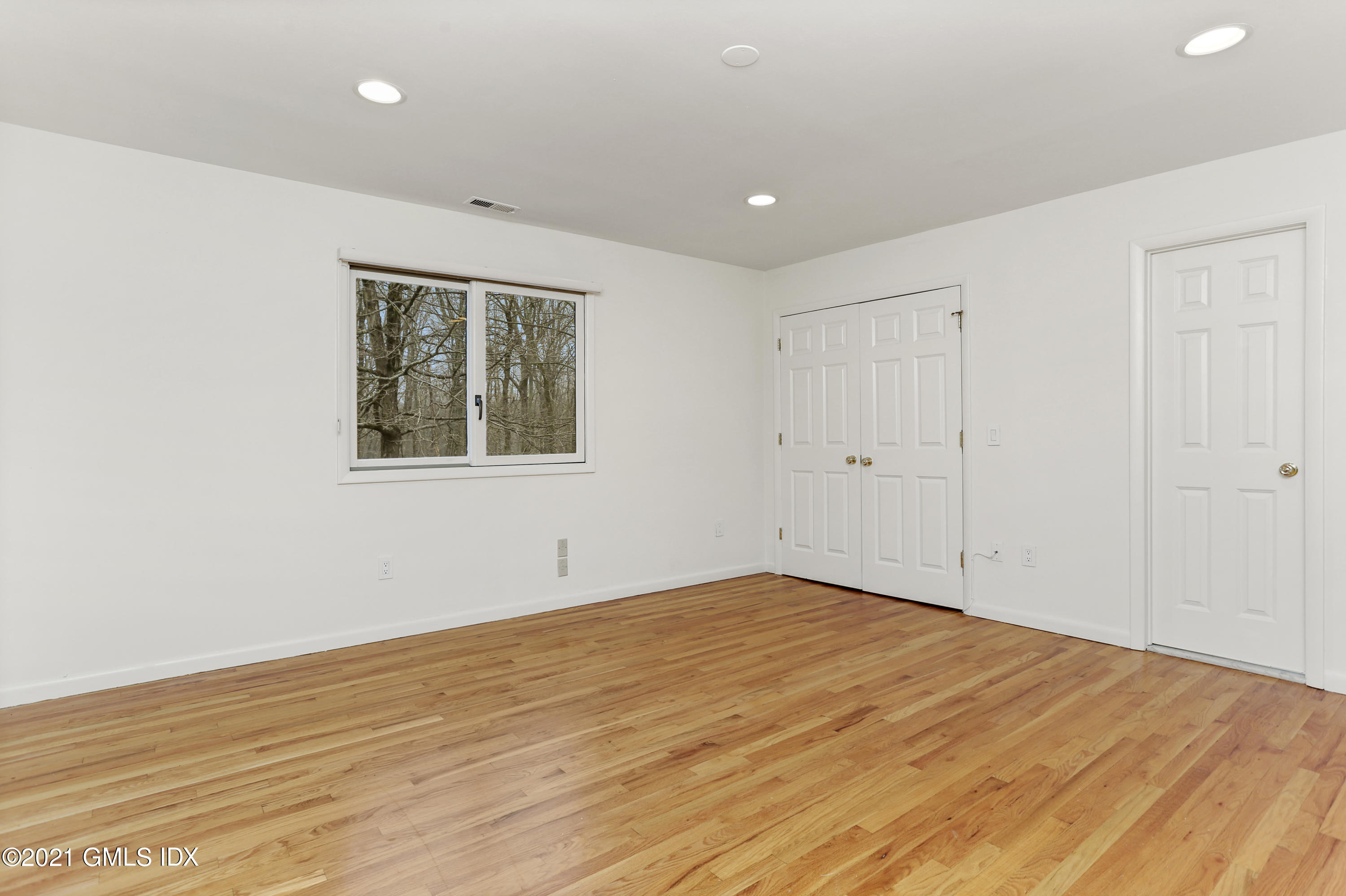 61 Sumner Road Greenwich, CT 06831 - Photo 14 of 19 a view of empty room with wooden floor and fan