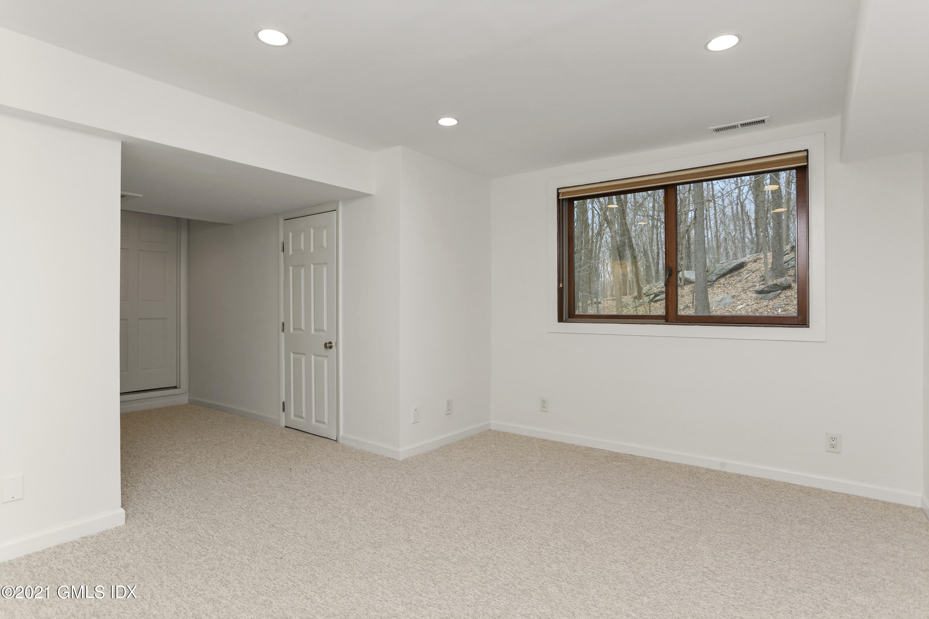 61 Sumner Road Greenwich, CT 06831 - Photo 15 of 19 an empty room with windows
