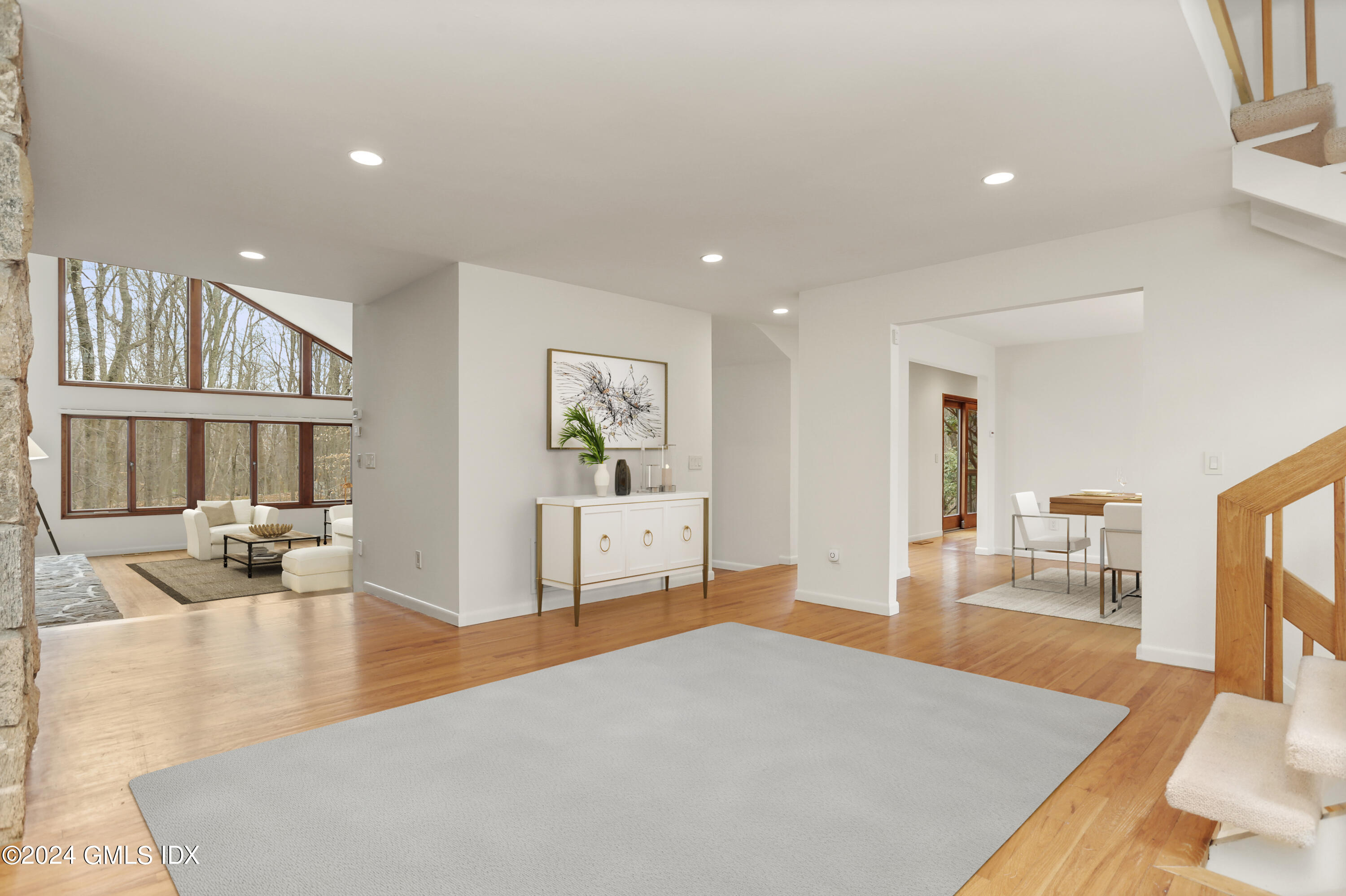 61 Sumner Road Greenwich, CT 06831 - Photo 4 of 19 a living room with furniture and a table