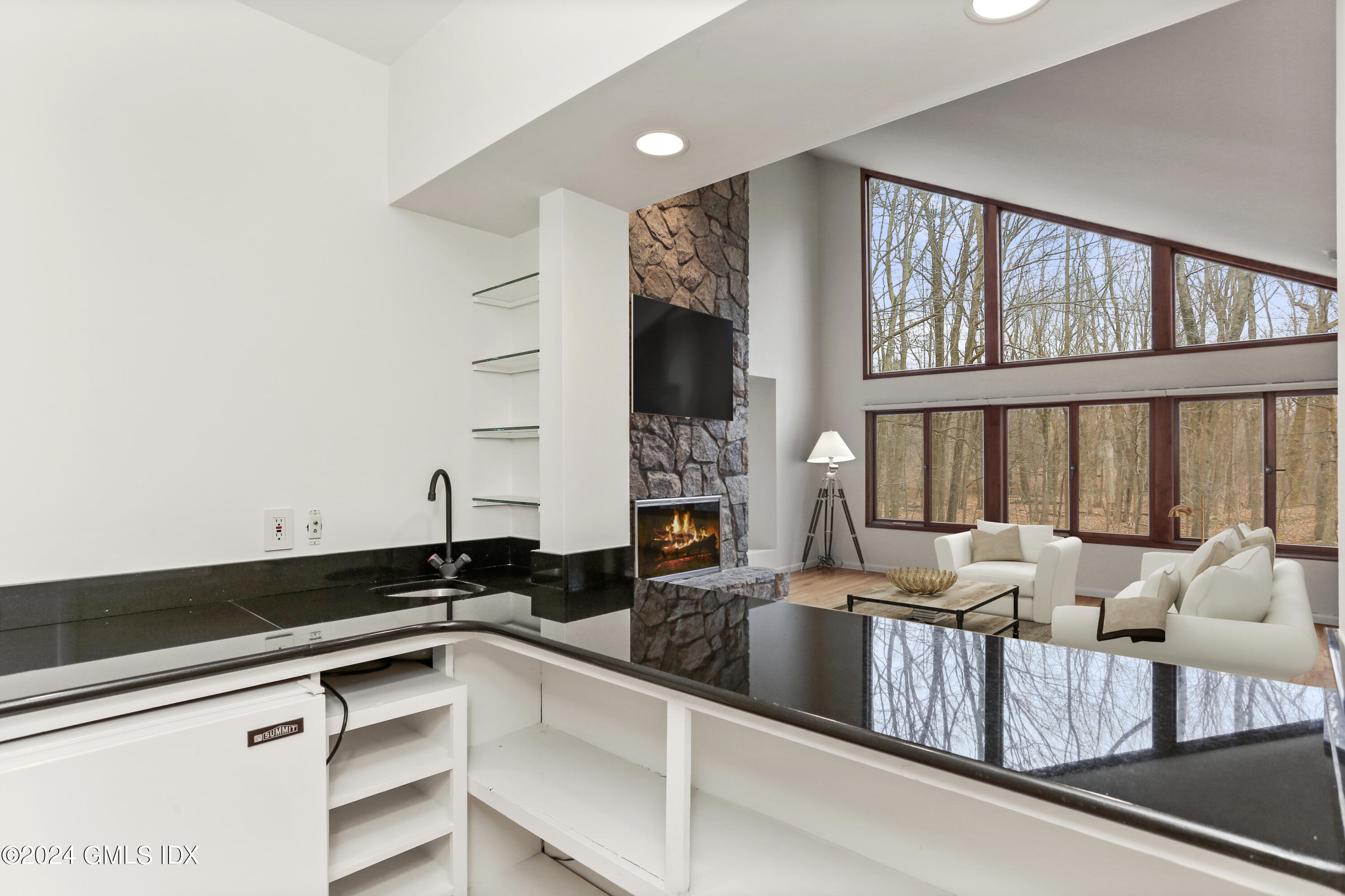 61 Sumner Road Greenwich, CT 06831 - Photo 5 of 19 a kitchen with a large window and cabinets