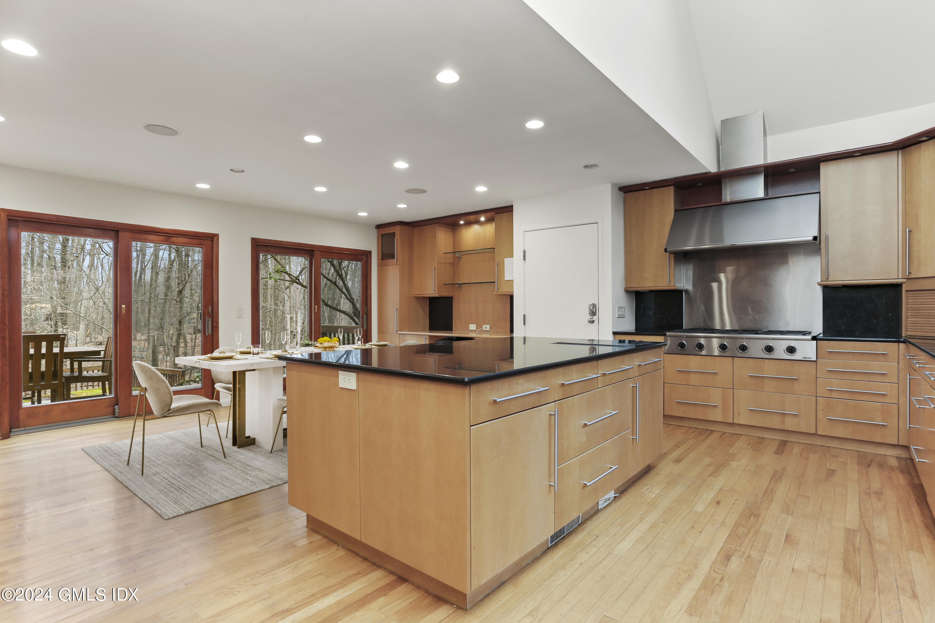 61 Sumner Road Greenwich, CT 06831 - Photo 8 of 19 a large kitchen with stainless steel appliances granite countertop a large center island and a sink