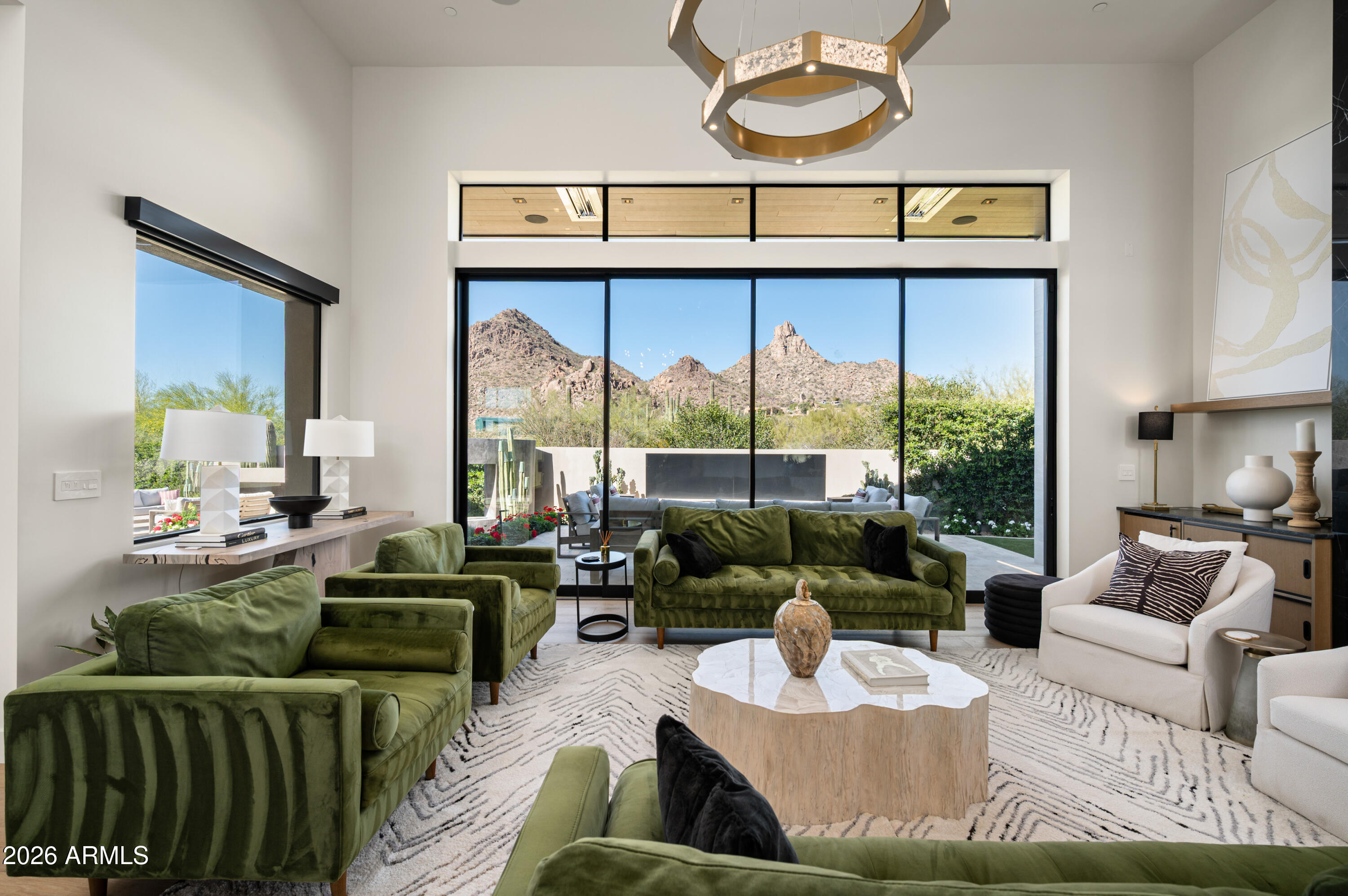 10040 East Happy Valley Road, Unit 13 Scottsdale, AZ 85255 - Photo 18 of 55 a living room with furniture and a large window