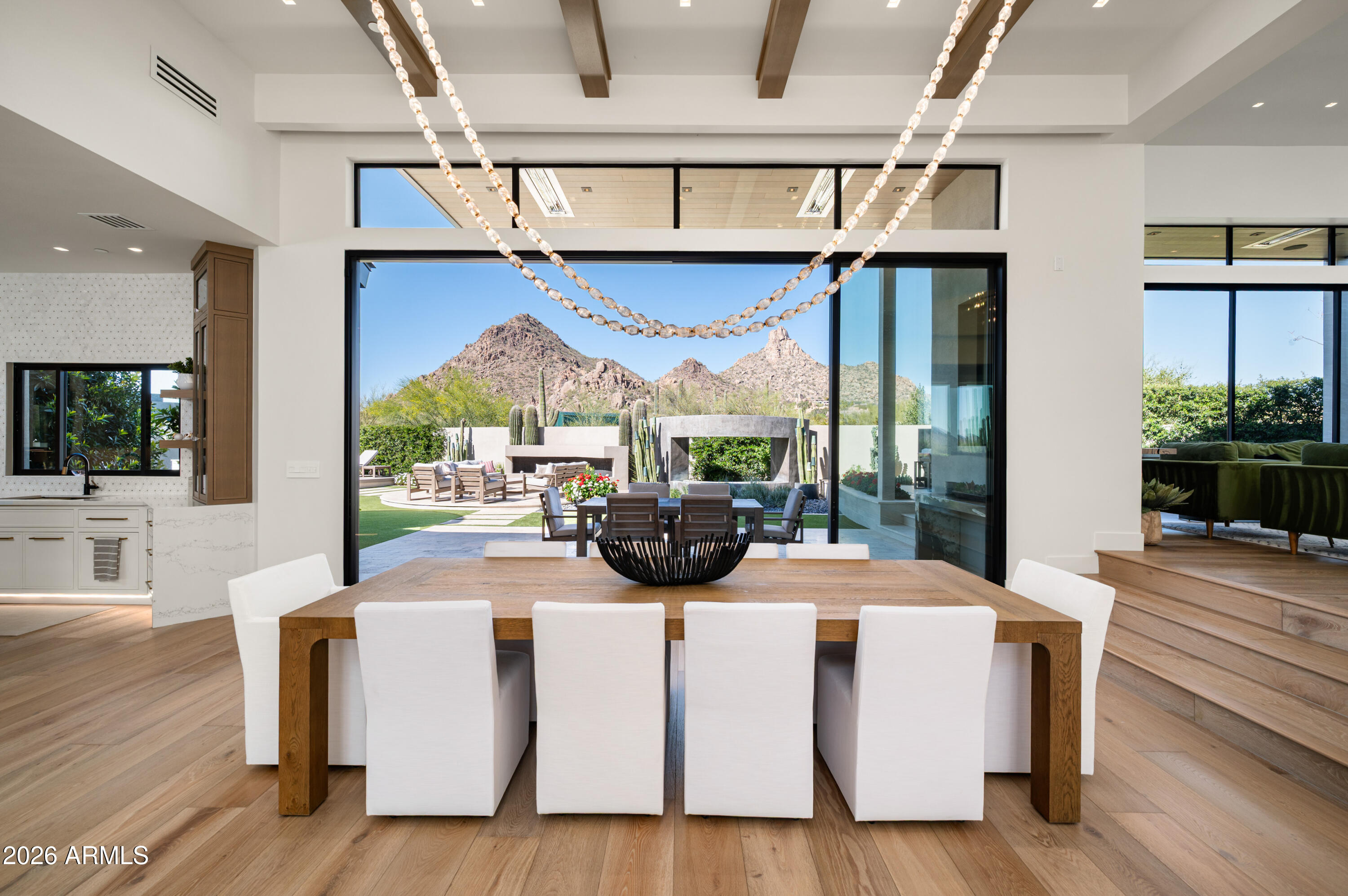 10040 East Happy Valley Road, Unit 13 Scottsdale, AZ 85255 - Photo 2 of 55 a view of living room kitchen with furniture and wooden floor
