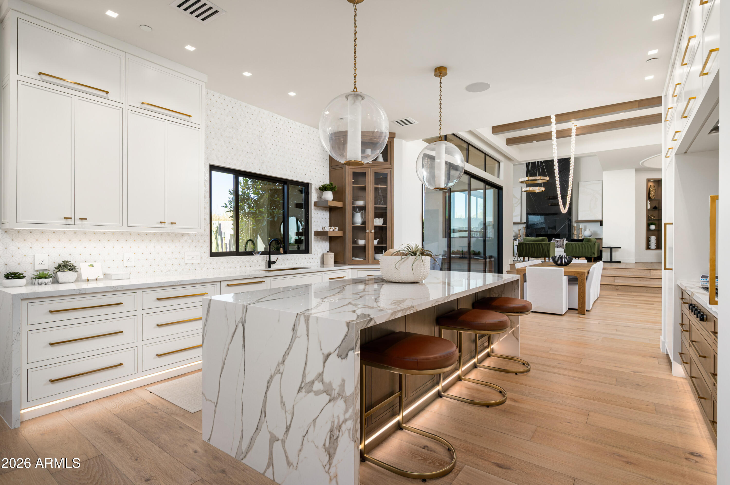 10040 East Happy Valley Road, Unit 13 Scottsdale, AZ 85255 - Photo 23 of 55 a kitchen with counter top space and wooden floor
