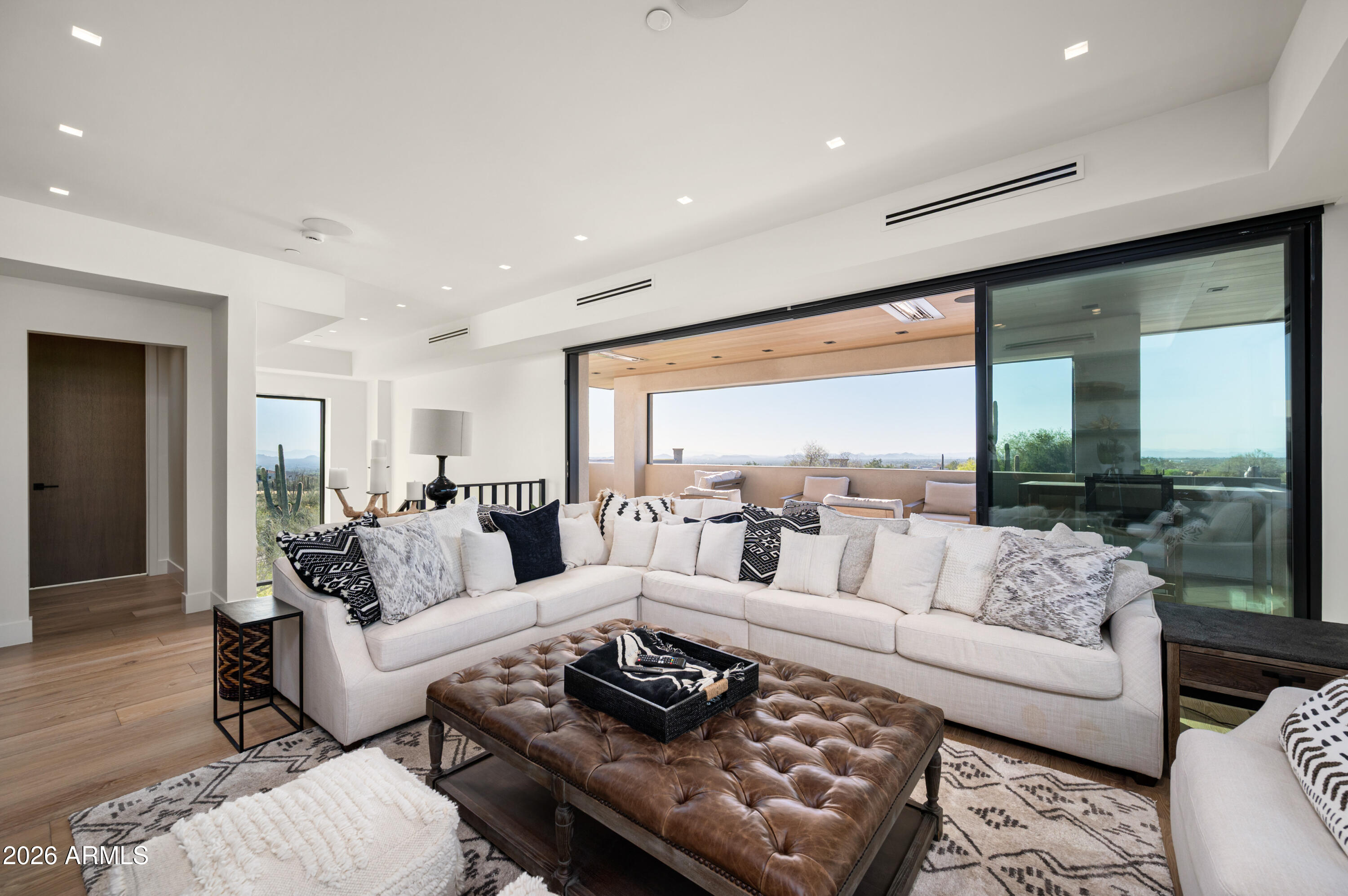 10040 East Happy Valley Road, Unit 13 Scottsdale, AZ 85255 - Photo 32 of 55 a living room with furniture and a large window