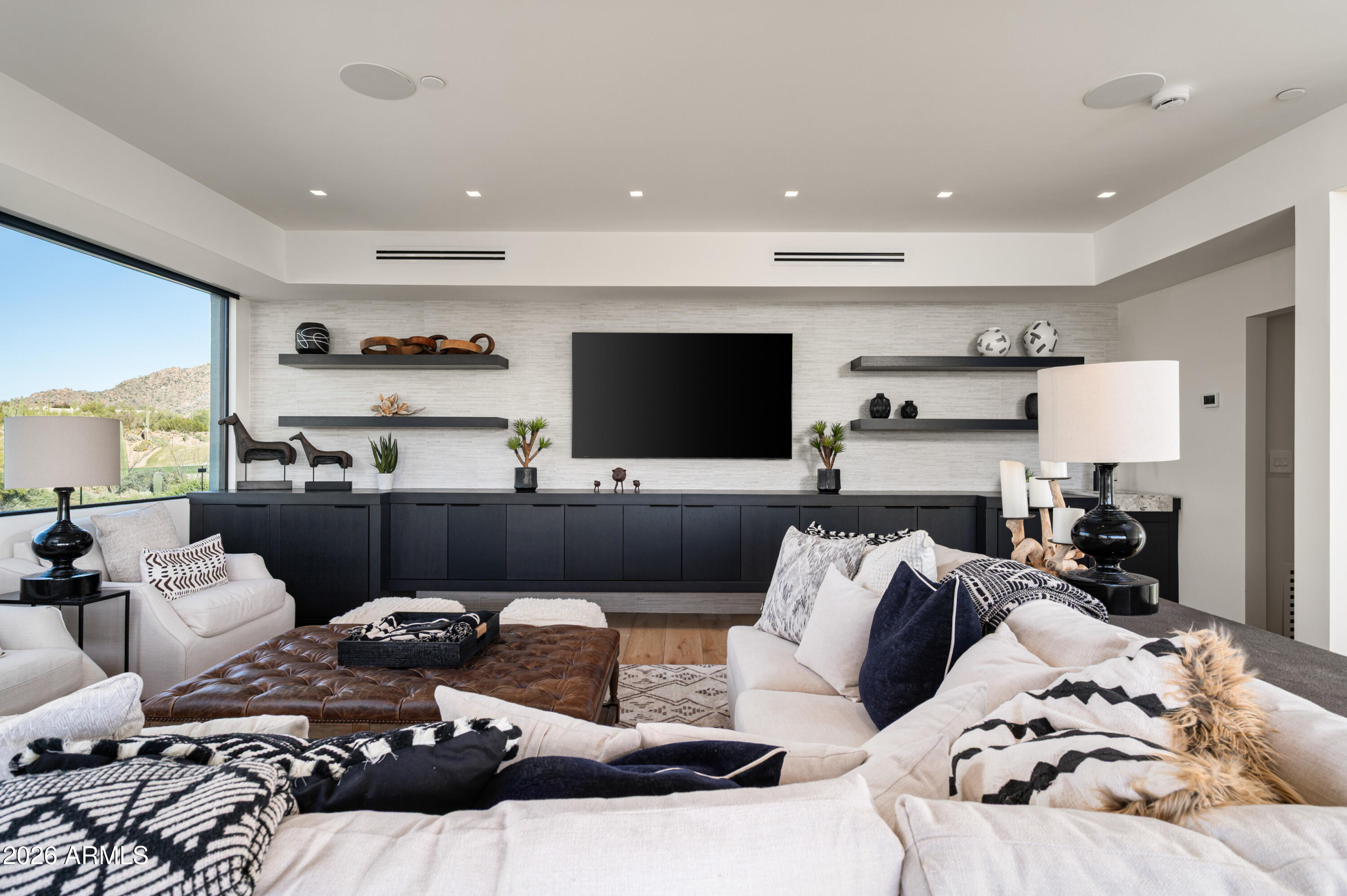 10040 East Happy Valley Road, Unit 13 Scottsdale, AZ 85255 - Photo 33 of 55 a living room with furniture and a flat screen tv