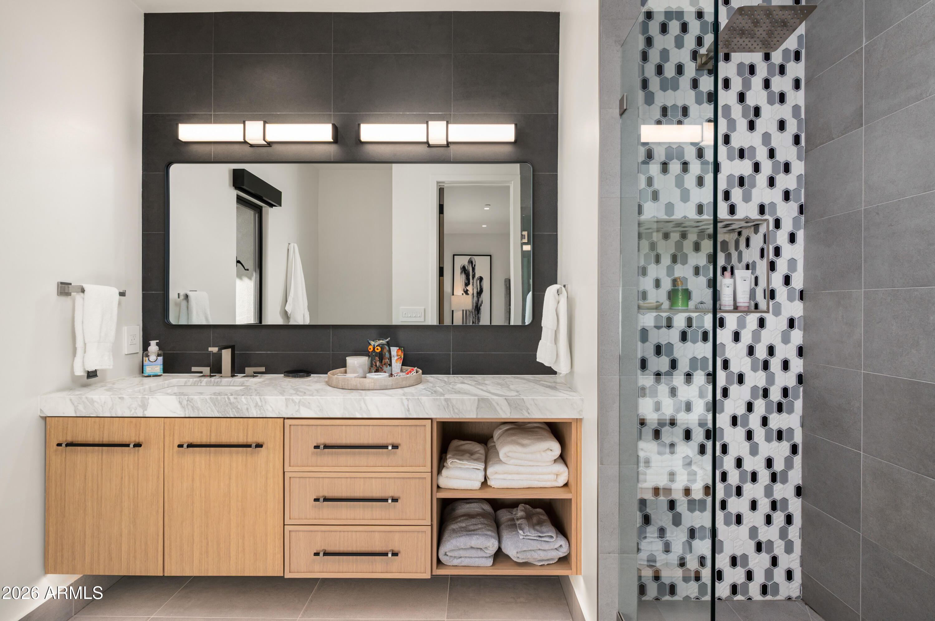 10040 East Happy Valley Road, Unit 13 Scottsdale, AZ 85255 - Photo 39 of 55 a bathroom with a granite countertop sink and a mirror