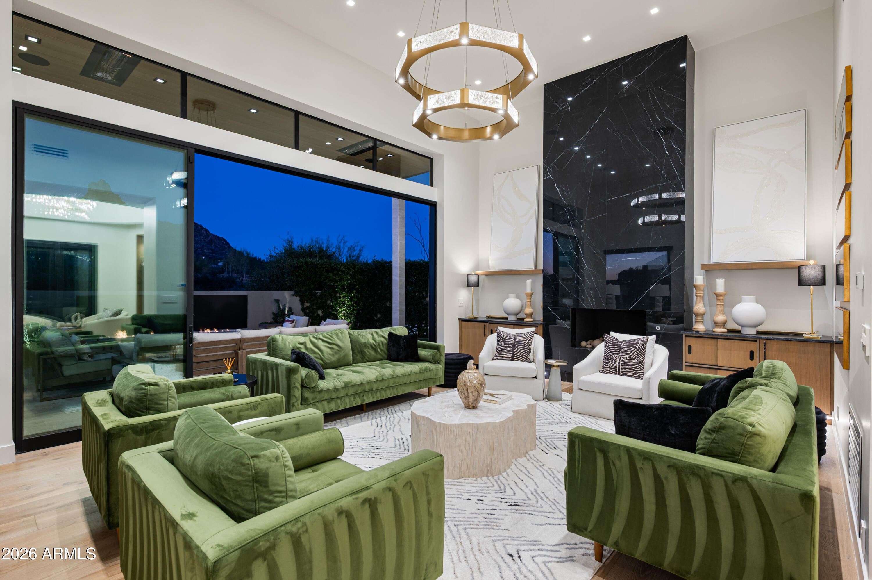 10040 East Happy Valley Road, Unit 13 Scottsdale, AZ 85255 - Photo 4 of 55 a living room with furniture and a fireplace