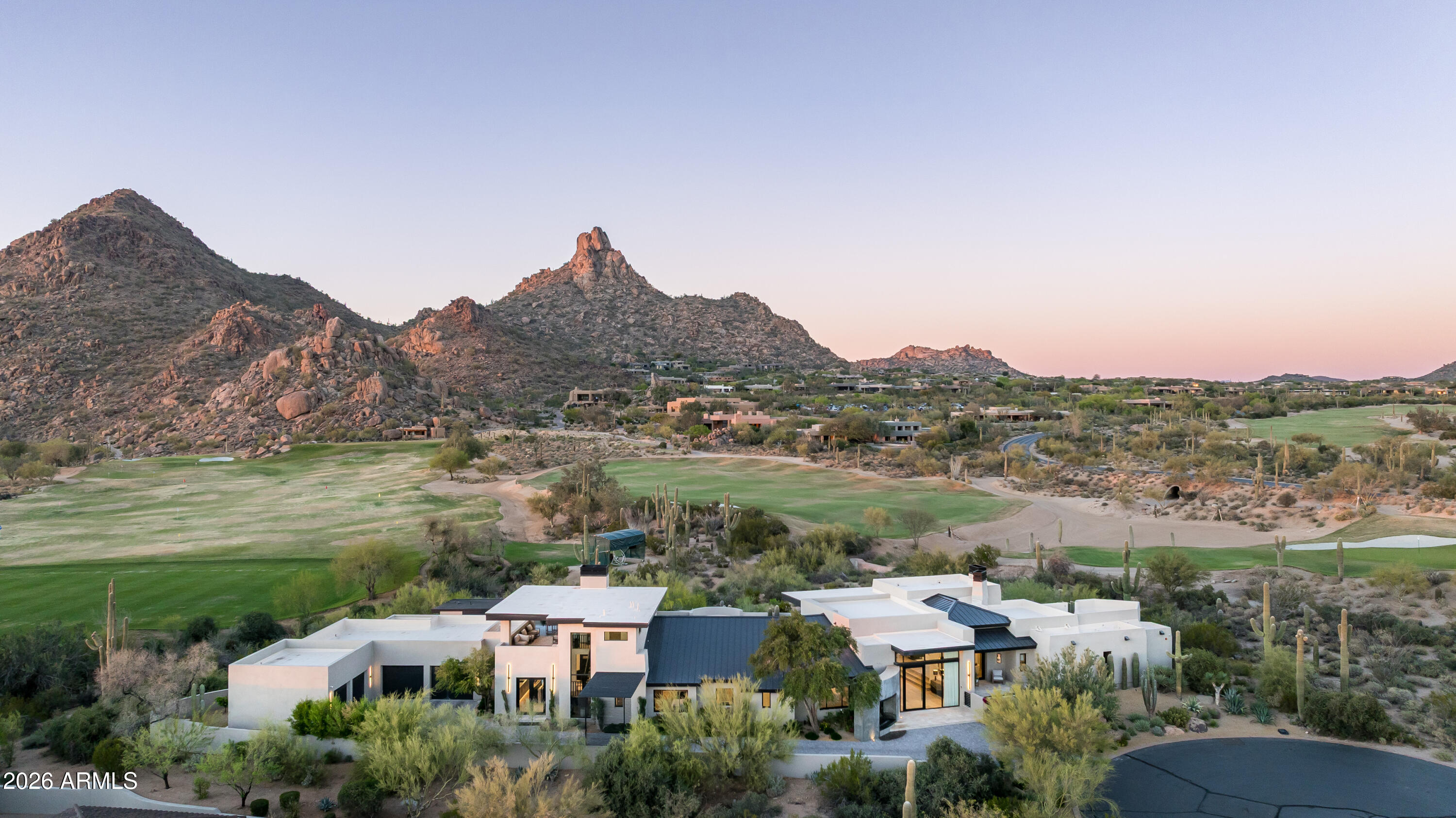 10040 East Happy Valley Road, Unit 13 Scottsdale, AZ 85255 - Photo 52 of 55 an aerial view of residential houses and lake view
