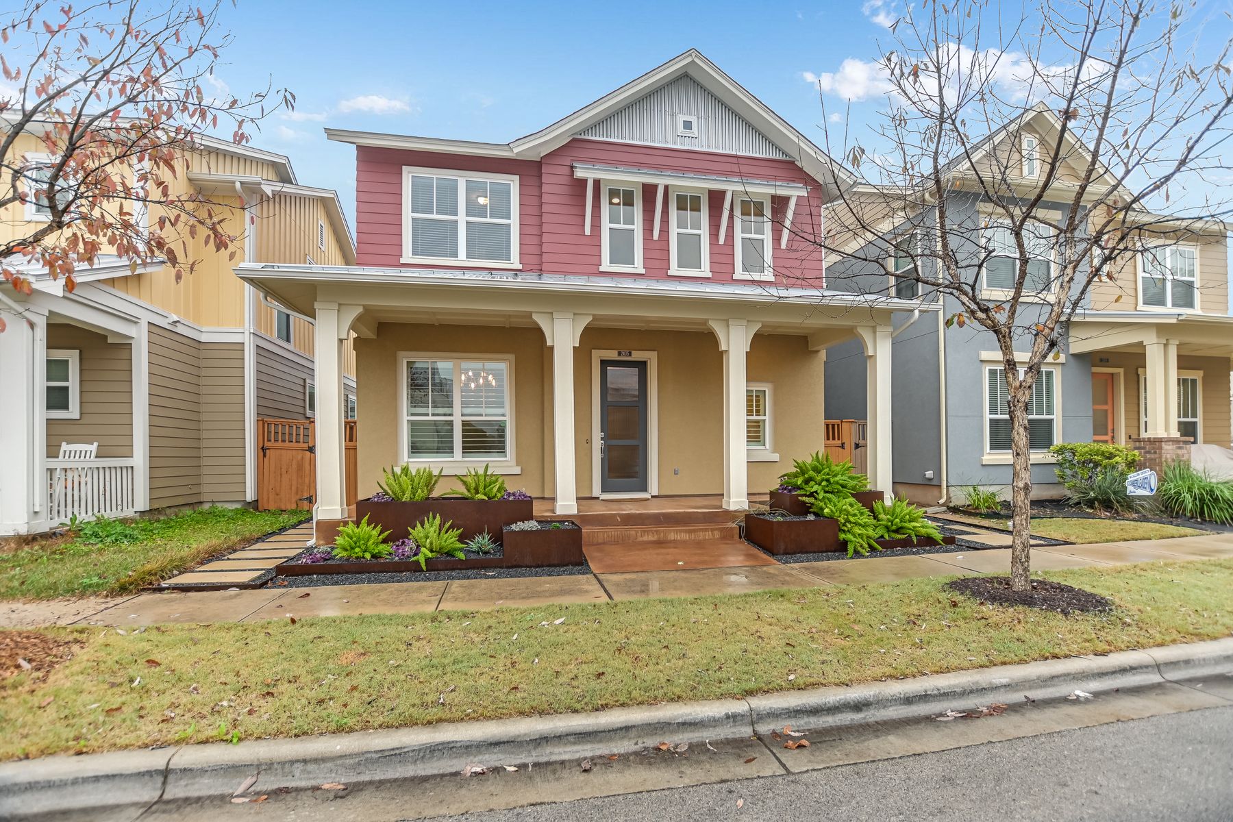 2405 Moreno Street Austin, TX 78723 - Photo 1 of 20 Custom planters and tidy, beautiful, bright landscaping add to the curb appeal of this home.