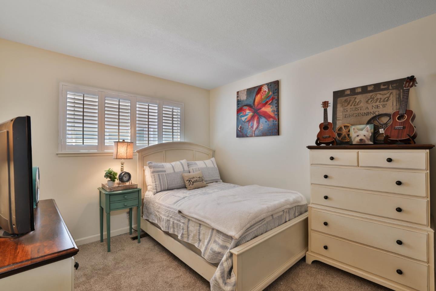 2314 Oak Flat Road San Jose, CA 95131 - Photo 15 of 36 a bedroom with a bed and a flat screen tv