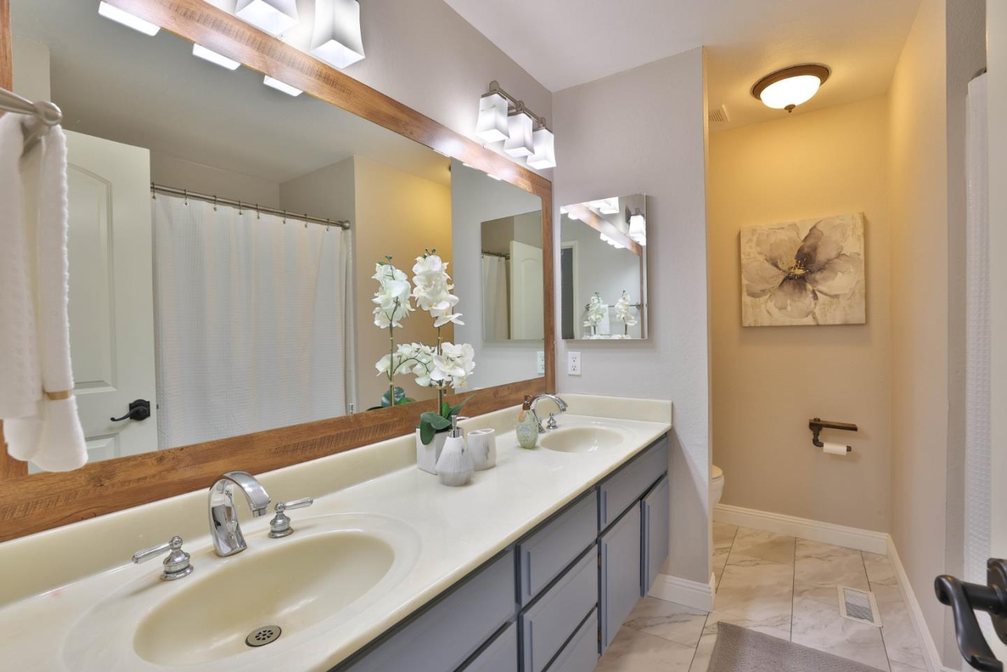 2314 Oak Flat Road San Jose, CA 95131 - Photo 17 of 36 a bathroom with a sink double vanity and a mirror