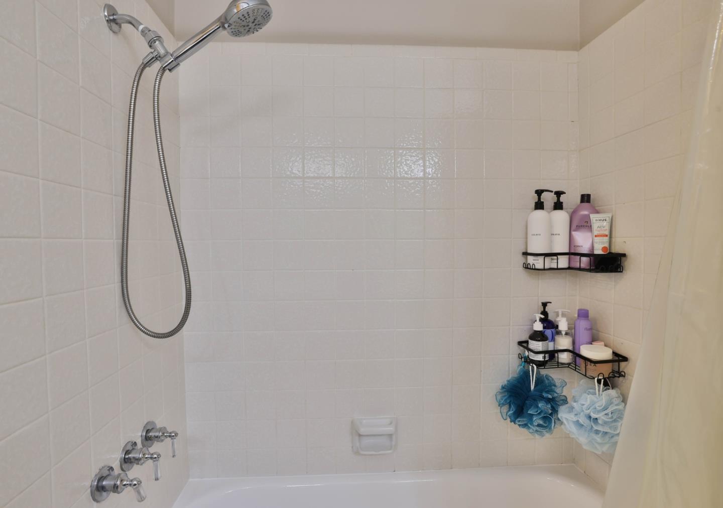 2314 Oak Flat Road San Jose, CA 95131 - Photo 18 of 36 a bathroom with a bath tub and a shower