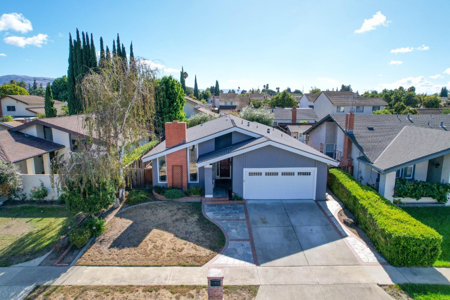 2314 Oak Flat Road San Jose, CA 95131 - Photo 2 of 36 a front view of a house with a yard