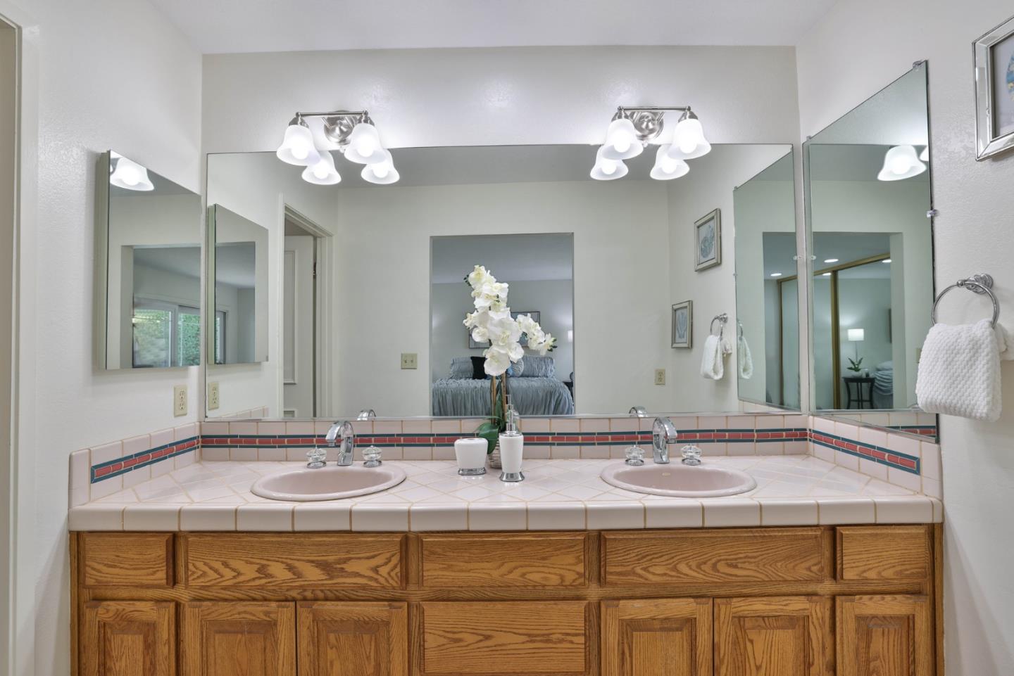 2314 Oak Flat Road San Jose, CA 95131 - Photo 21 of 36 a bathroom with a sink double vanity and a mirror