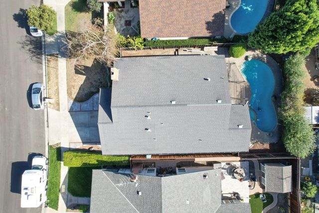 an aerial view of houses with outdoor space