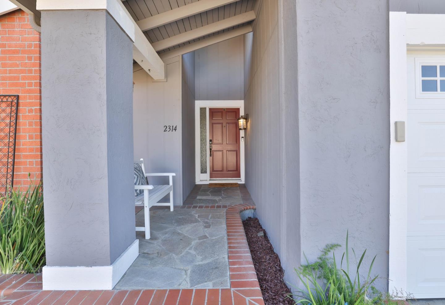 2314 Oak Flat Road San Jose, CA 95131 - Photo 3 of 36 a view of a hallway with wooden floor and a potted plant