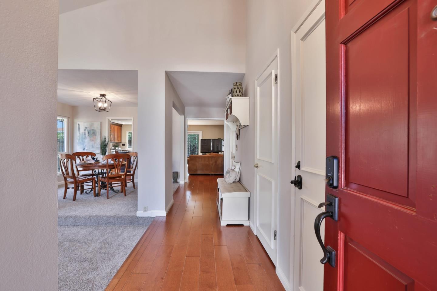 2314 Oak Flat Road San Jose, CA 95131 - Photo 4 of 36 a view of a hallway with dining area and glass doors