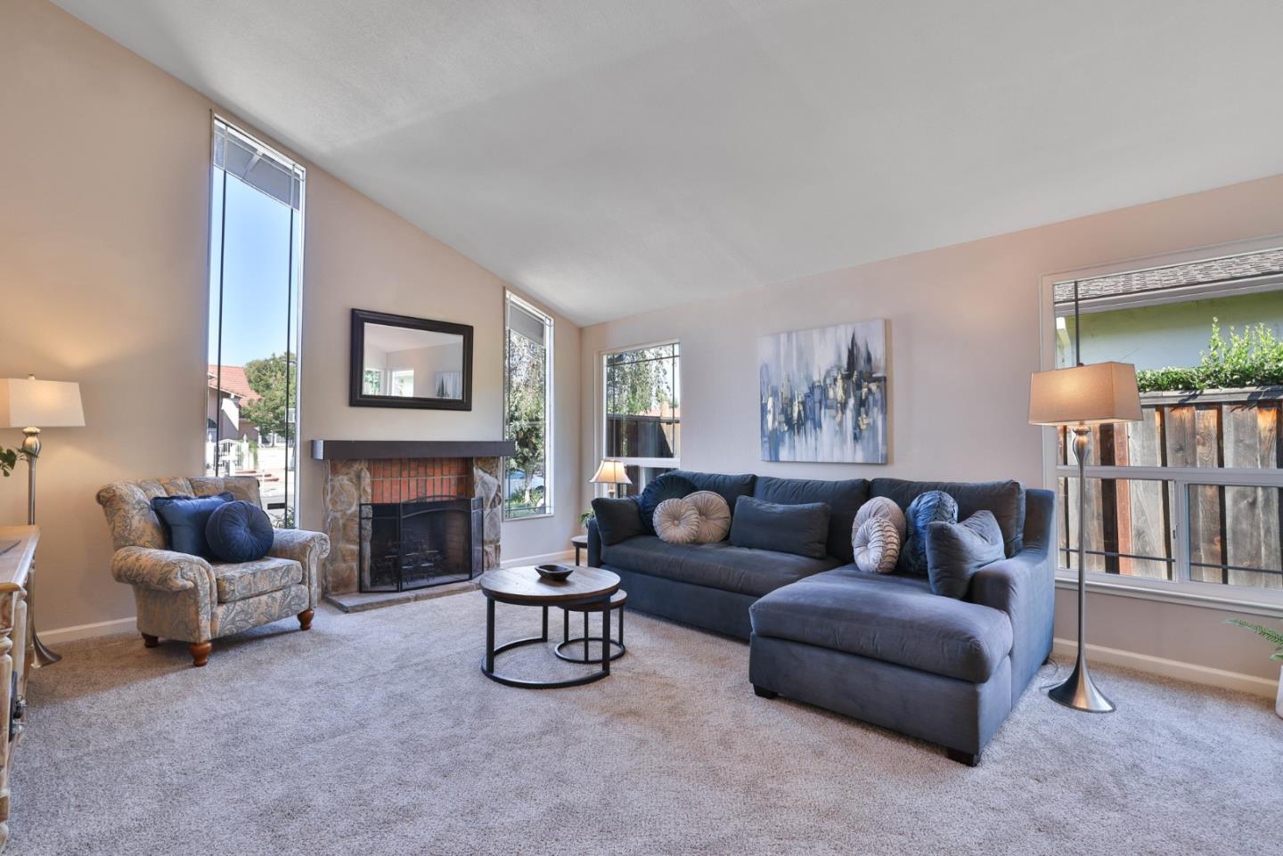 2314 Oak Flat Road San Jose, CA 95131 - Photo 5 of 36 a living room with furniture and a fireplace