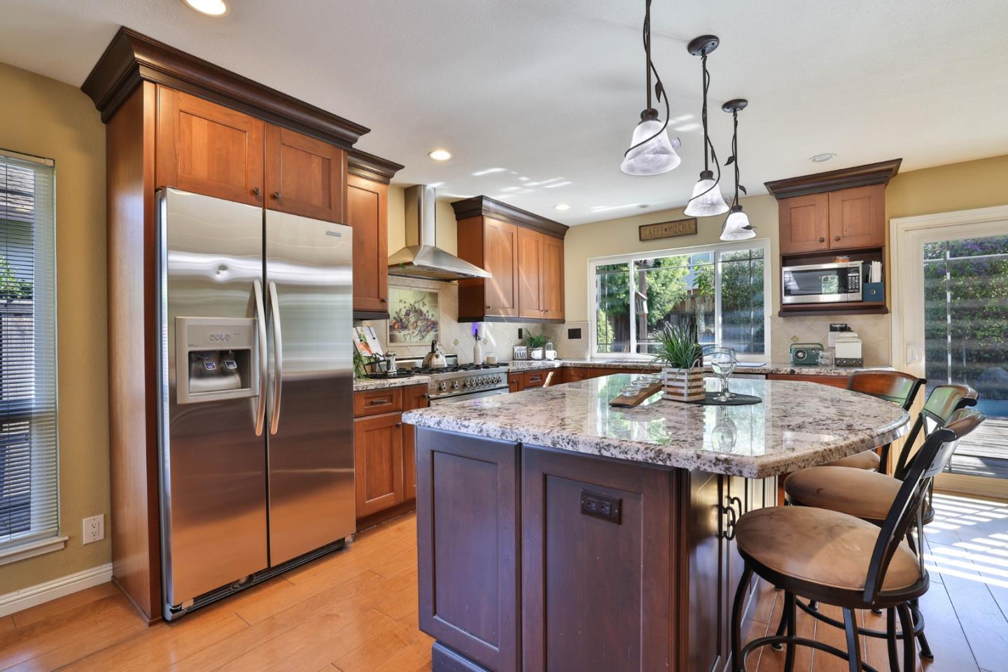 2314 Oak Flat Road San Jose, CA 95131 - Photo 10 of 36 a kitchen with stainless steel appliances granite countertop a sink a stove and a refrigerator