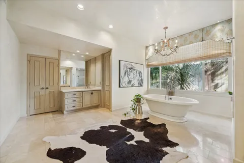 a bed room with a bed and a chair