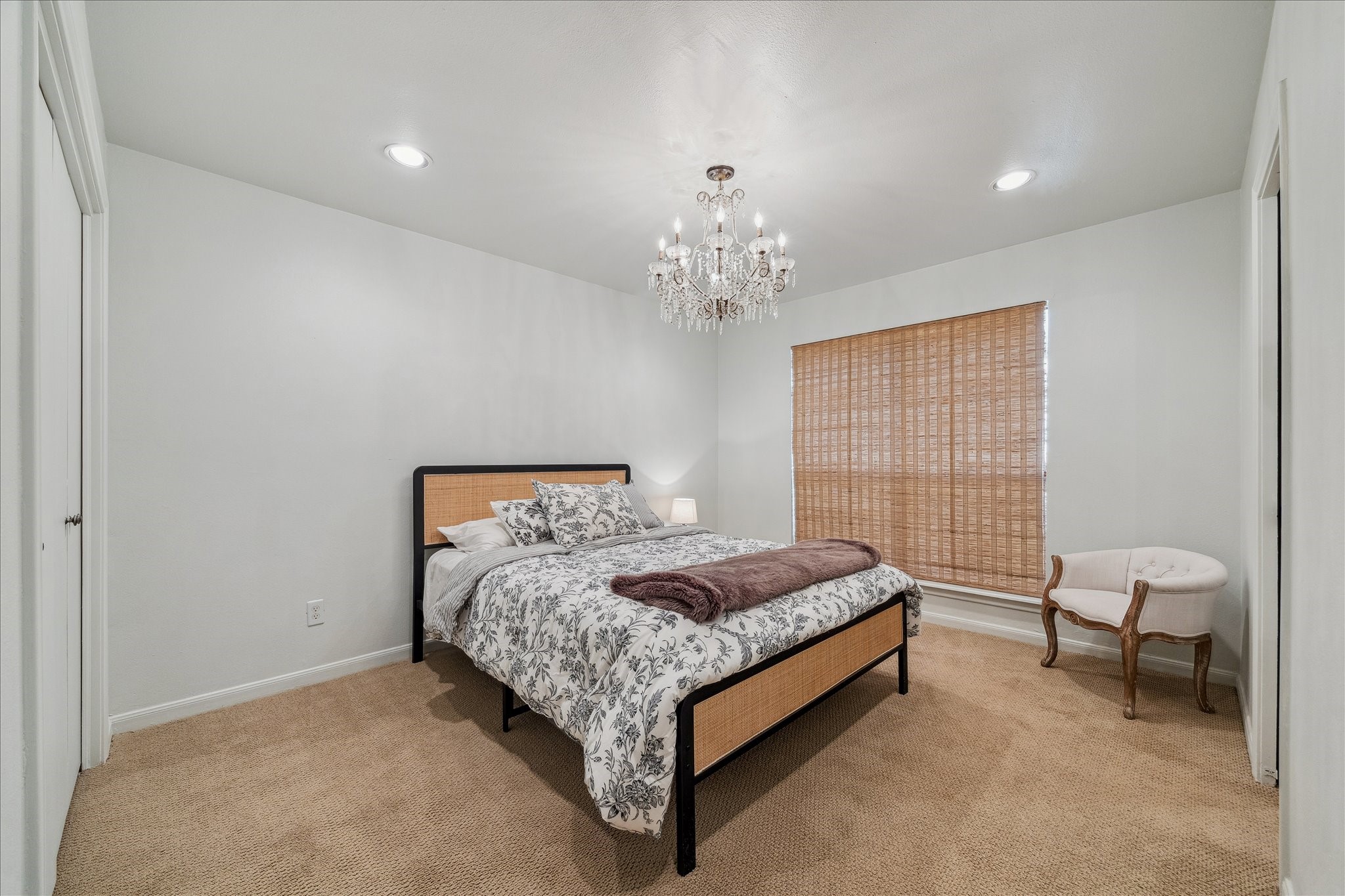 230 Gessner Road Houston, TX 77024 - Photo 23 of 31 a bed room with a bed and a chair