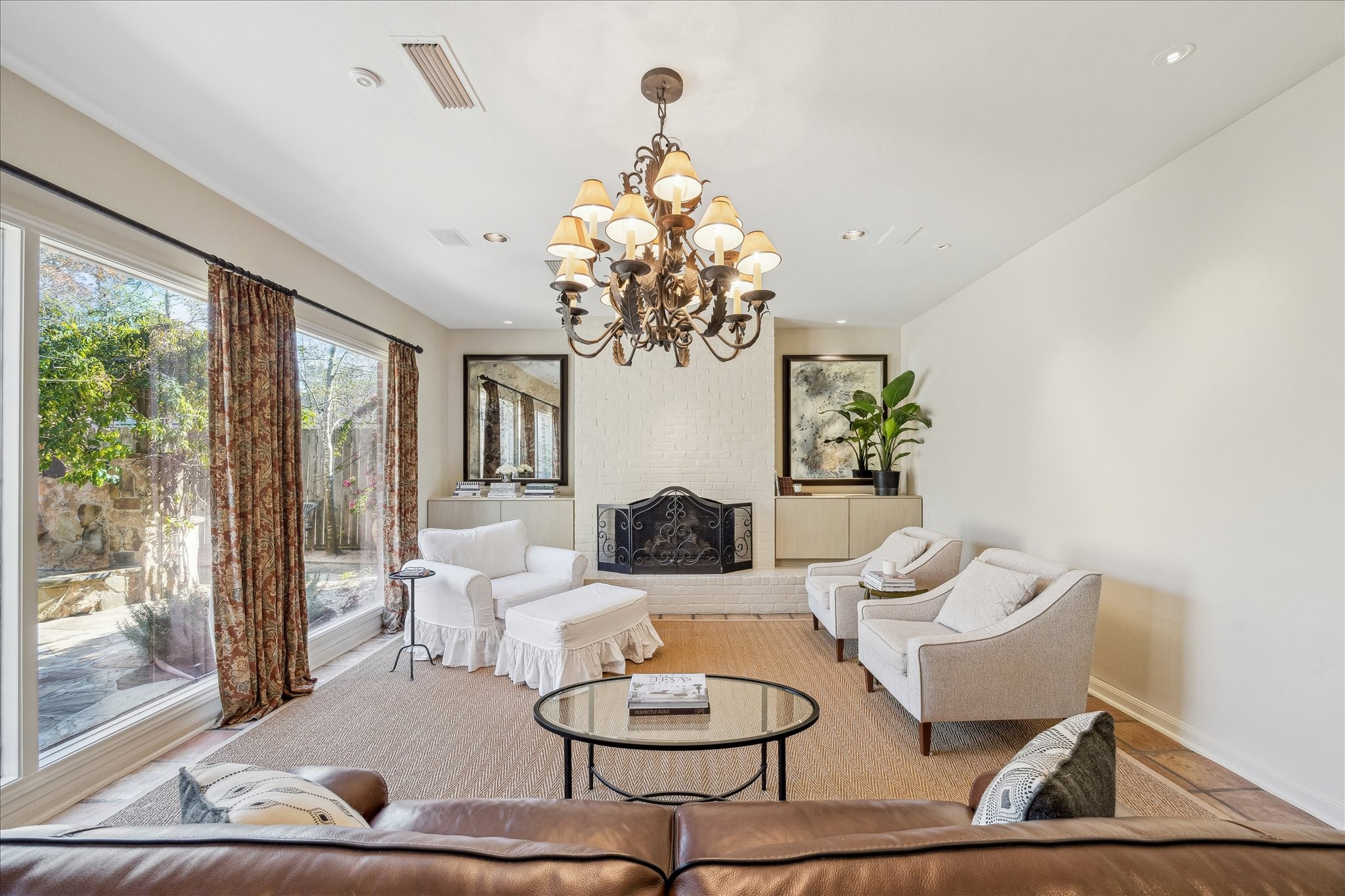 230 Gessner Road Houston, TX 77024 - Photo 4 of 31 a living room with furniture and a chandelier