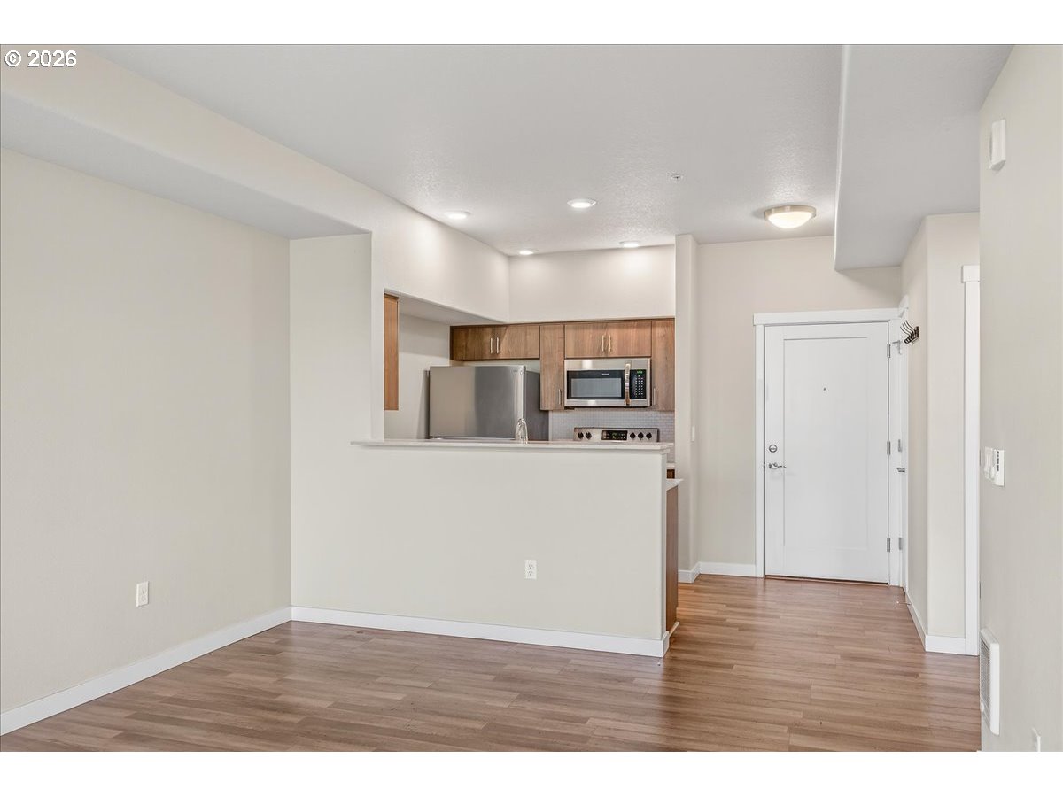 16401 Northwest Chadwick Way, Unit 108 Portland, OR 97229 - Photo 16 of 29 a view of kitchen with refrigerator and microwave