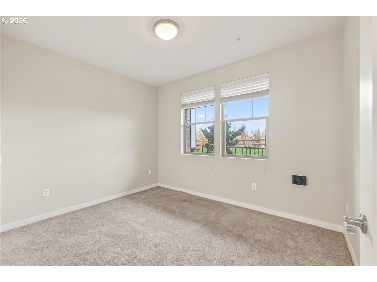 16401 Northwest Chadwick Way, Unit 108 Portland, OR 97229 - Photo 17 of 29 a view of an empty room with a window