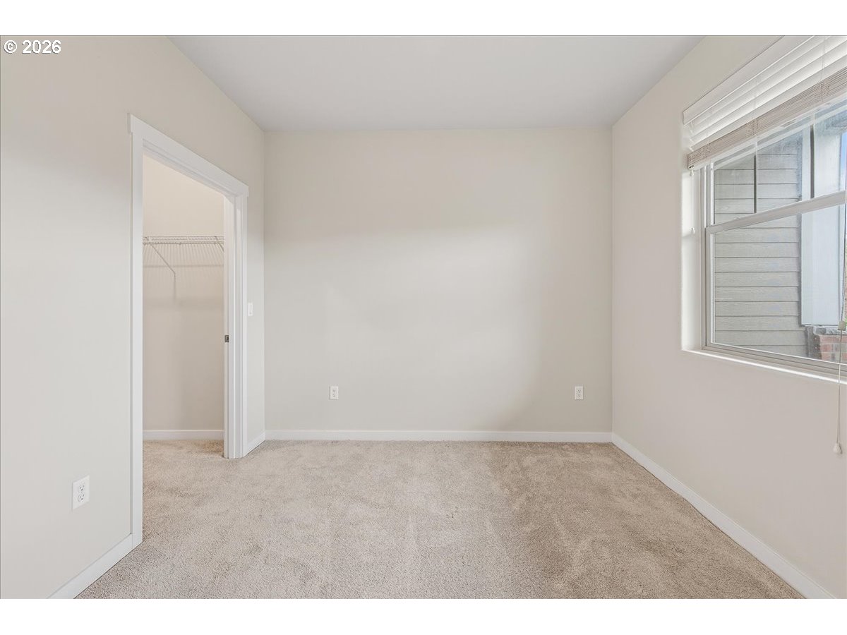16401 Northwest Chadwick Way, Unit 108 Portland, OR 97229 - Photo 18 of 29 a view of an empty room with a window