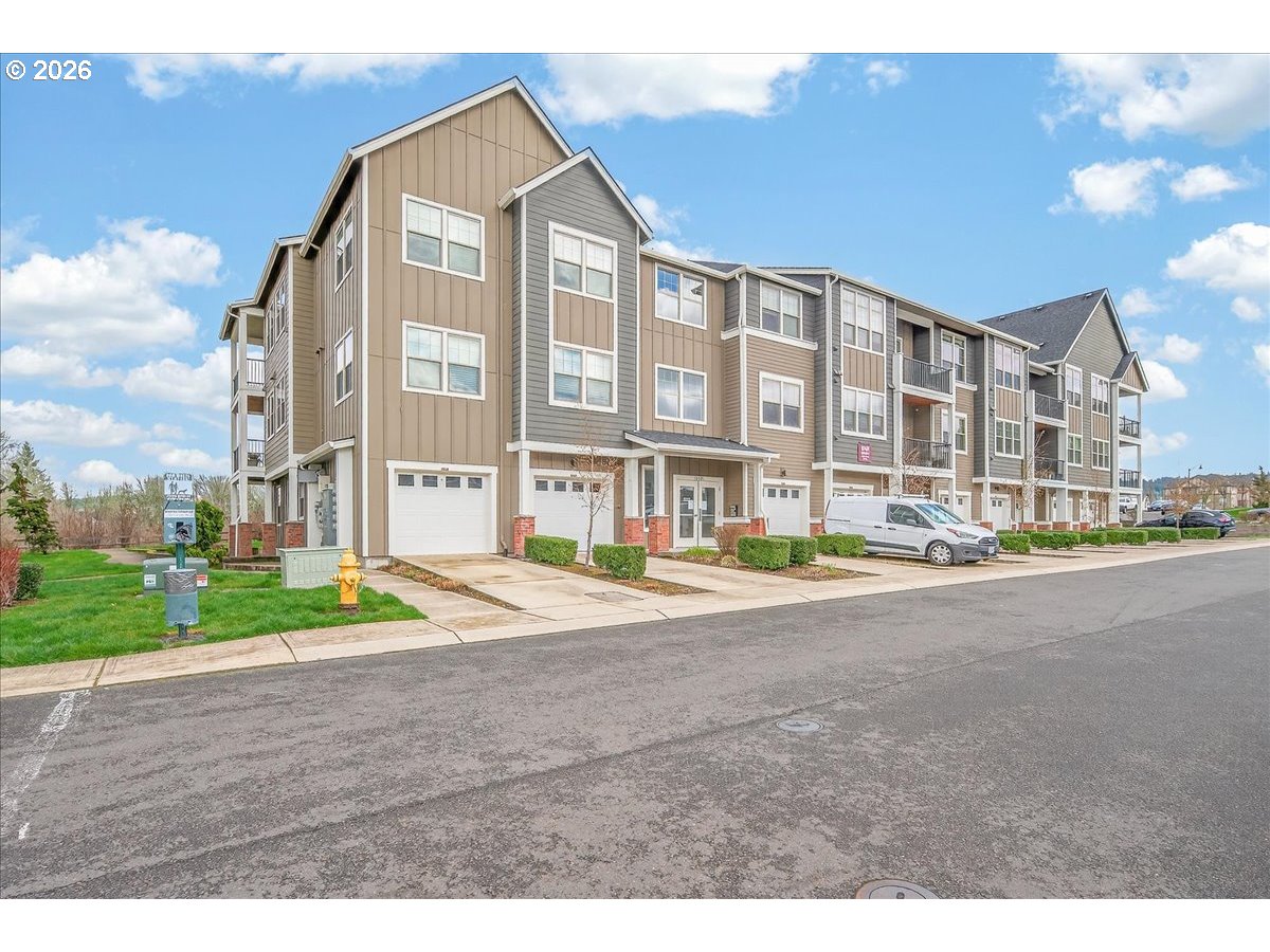 16401 Northwest Chadwick Way, Unit 108 Portland, OR 97229 - Photo 2 of 29 a view of a big building with a street