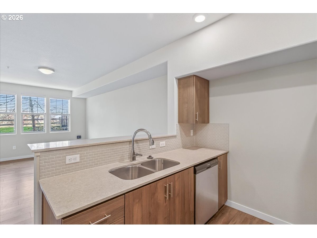 16401 Northwest Chadwick Way, Unit 108 Portland, OR 97229 - Photo 21 of 29 a kitchen with a sink and cabinets