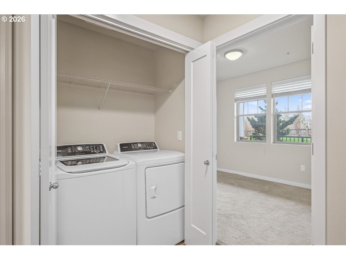 16401 Northwest Chadwick Way, Unit 108 Portland, OR 97229 - Photo 24 of 29 a utility room with dryer and washer